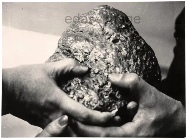 Hands Faceless woman Hidden girl Shiny nugget Mineral Mistake Odd unusual photo