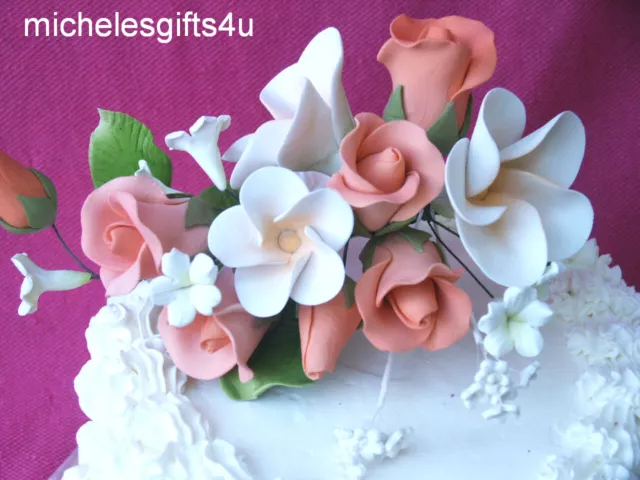 Pasta de goma melocotón naranja rosas blancas frangipani pastel de azúcar hawaiano flores Pasta de goma melocotón naranja rosas blancas frangipani pastel de azúcar hawaiano flores