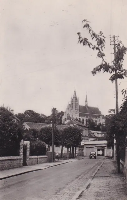 Antique postcard MONTMORENCY rue de la republique church car