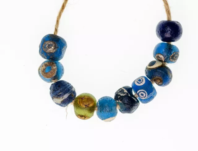 A short strand of 10 Small Ancient Islamic Period Blue Evil Eye Beads 0043