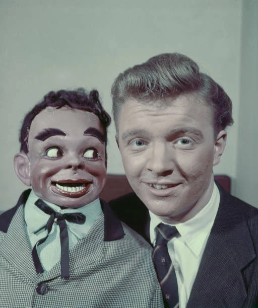 BRITISH VENTRILOQUIST DENNIS Spicer posing with his dummy James 1955