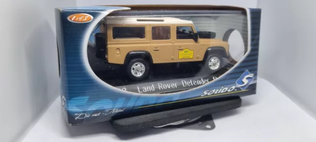 Modello in scala 1/43 Land Rover Defender Camel Rally Beige Solido 1562