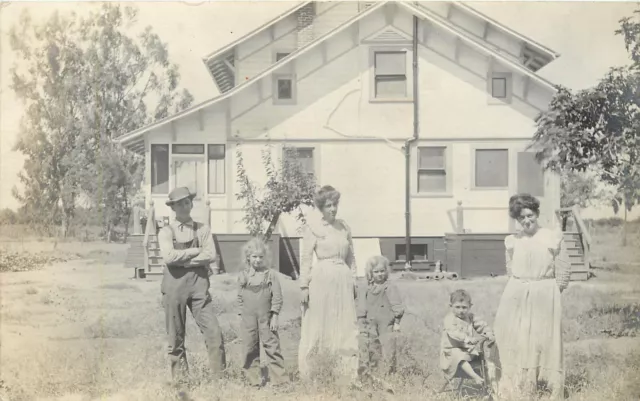 UDB RPPC; Family outside House, Child on Tricycle, possibly Pacific Grove CA