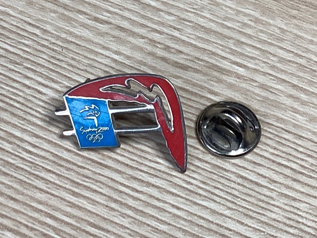 Pin's olympique Mexico 1968, pictogramme avec logo en bronze
