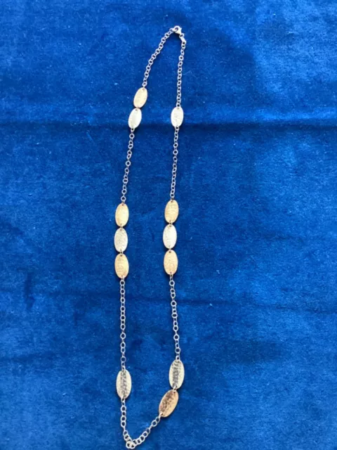 Sterling silver necklace with Silver and gold plated hammered oval discs. 925