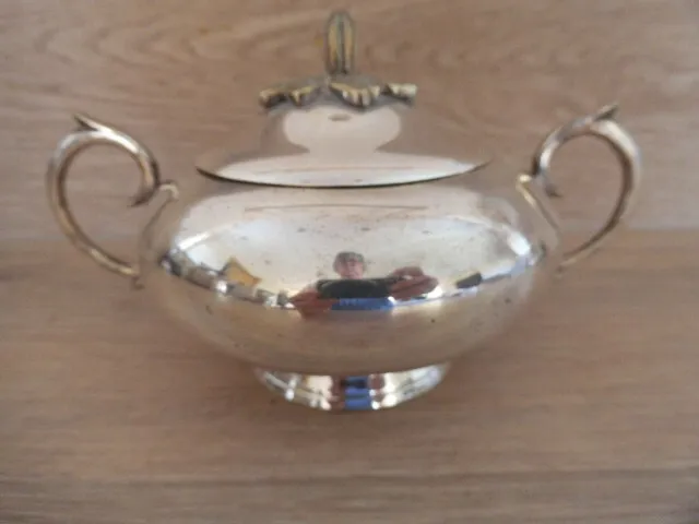 Lovely Silver plated lidded sugar bowl of simple form with leaf top decoration