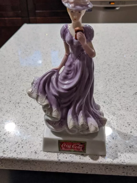 Coca Cola 8" Ladies With beautiful Purple Dresses 2000 Porcelain Figurine.