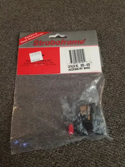 Stroboframe locking accessory shoe. USA made. Tiffen. Cat No 300-405. NOS Stroboframe locking accessory shoe. USA made. Tiffen. Cat No 300-405. NOS