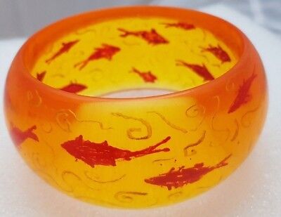 Prystal Lucite Bangle Bracelet Reverse Carved fish Back Carved