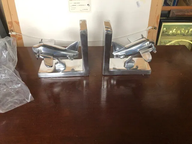 a pair of chrome bomber bookends