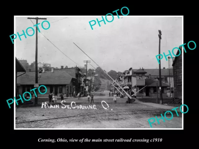 OLD POSTCARD SIZE PHOTO OF CORNING OHIO VIEW OF MAIN St RAILROAD CROSSING 1910